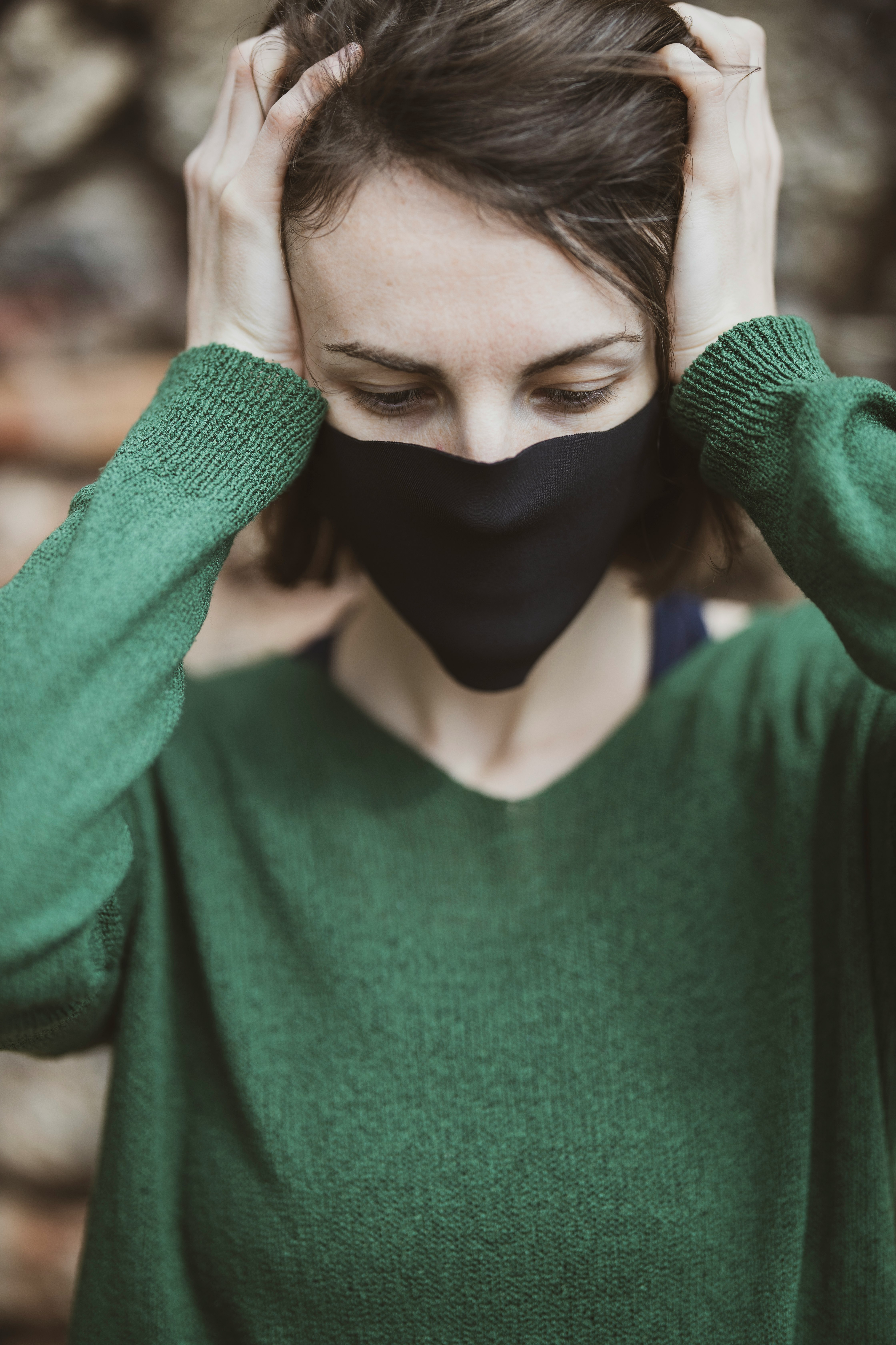 woman in green v neck sweater